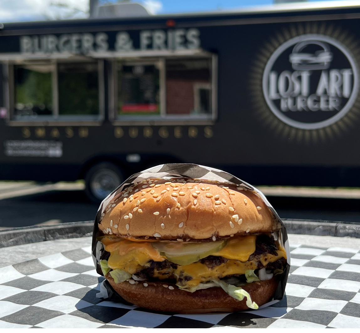 Burger in front of the truck
